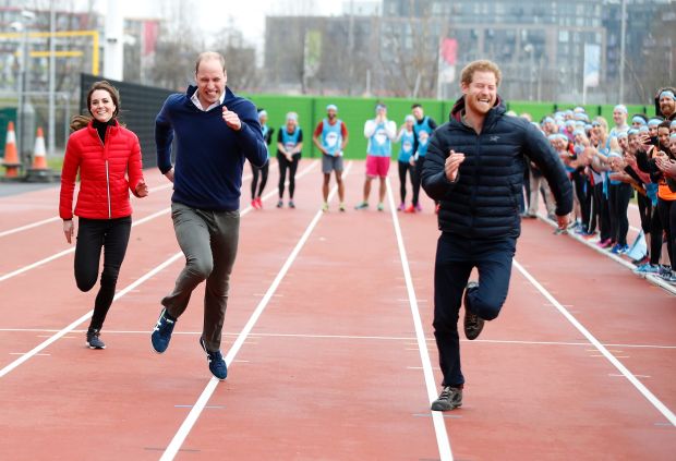 Britain's Catherine, Duchess of Cambridge (L), Britain's Prince William, Duke of Cambridge (C) and Britain's Prince Harry (R) take part in a relay race, during a training event to promote the charity Heads Together, at the Queen Elizabeth Olympic Park in London, on February 5, 2017.
The Duke and Duchess of Cambridge and Prince Harry join a training day with the runners taking part in the 2017 Virgin Money London Marathon for Heads Together, the official Charity of the Year. / AFP PHOTO / POOL / Alastair GrantALASTAIR GRANT/AFP/Getty Images  (Royals not expected for the .01K WC)